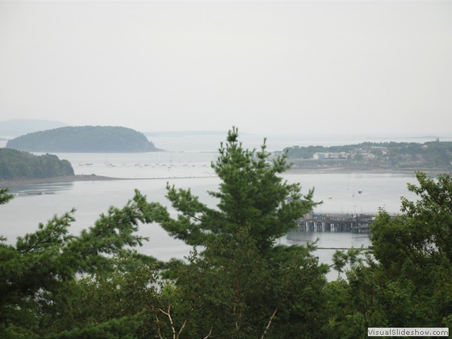 July 29: We shuttled to the Docksider restaurant in Northeast Harbor, had lunch, then bicycled 17 miles to Bar Harbor in the rain.  Here is a scene along the way.