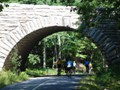 July 30: In Acadia National Park.  We passed over and under many of the 17 stone bridges, and rode quite a few miles on the crushed stone Carriage Road which is limited to hiking and biking.